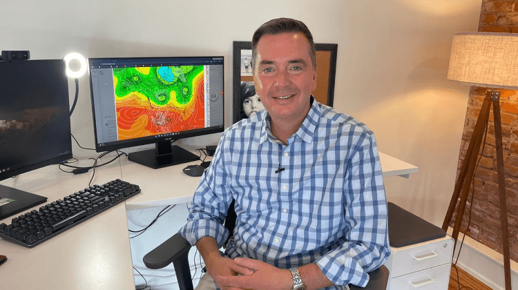 Chris Goode, CEO of Climavision, sits in front of computer with heat map displayed