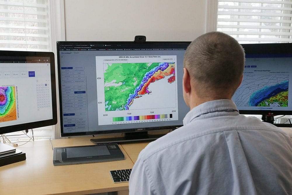 Peter Childs viewing weather data visual on computer