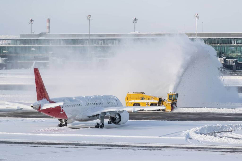 Airplane stuck on runway in the snow