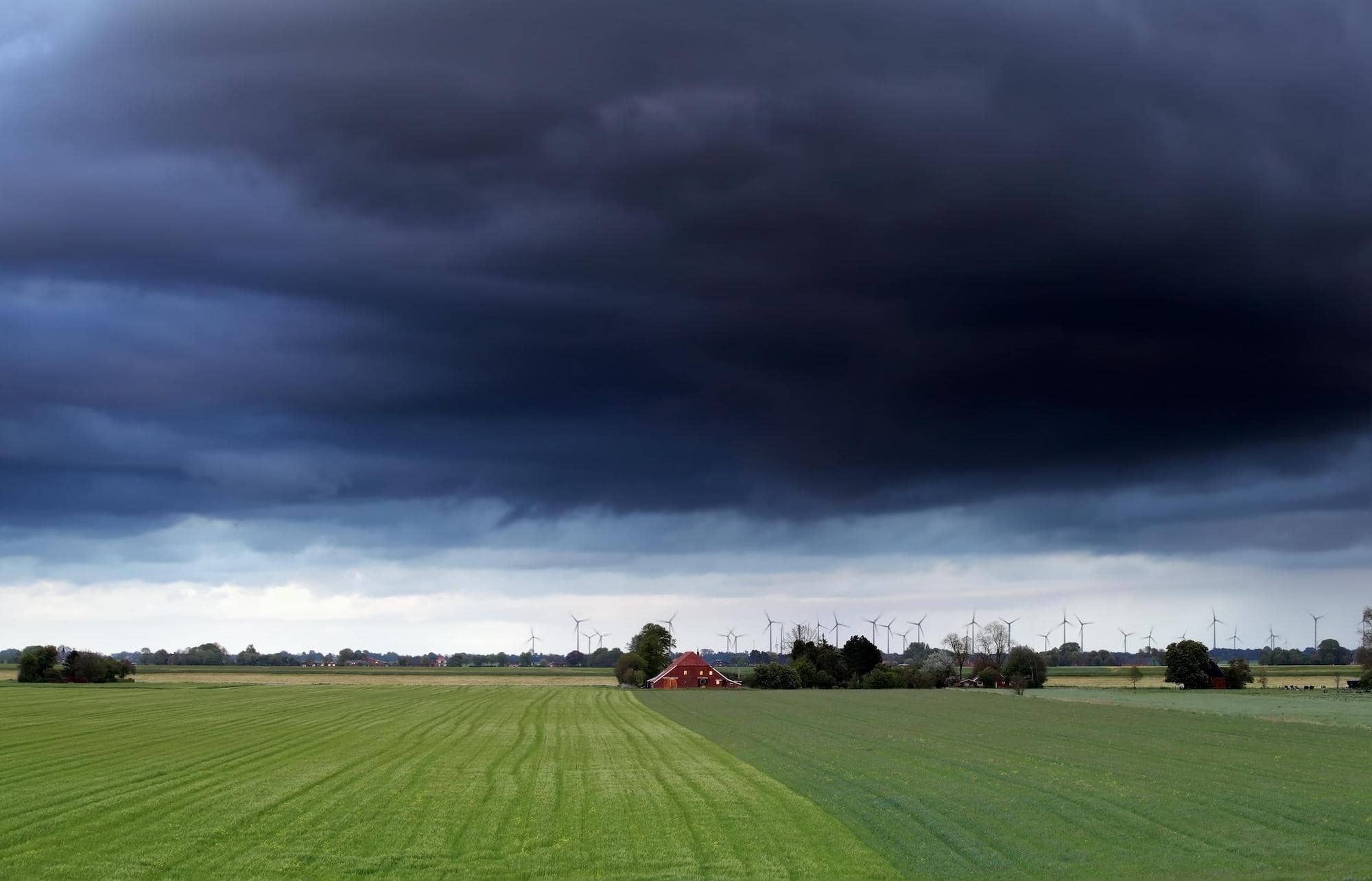 Dark storm skies over a farm